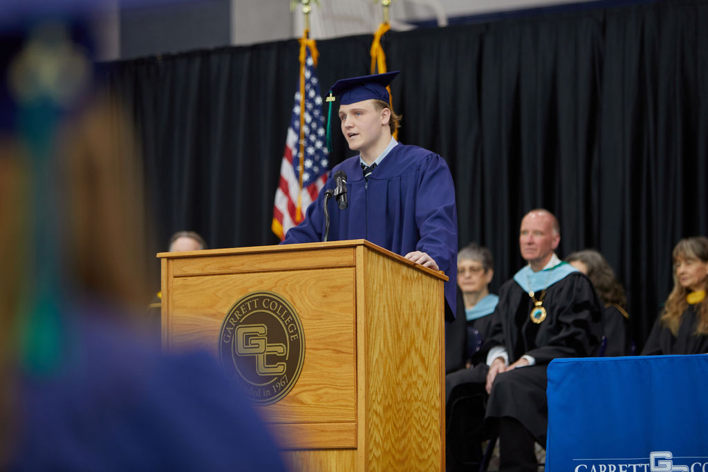 graduation speaker photographed from the crowd